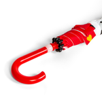 Red and white umbrella with a unique handle design on a white background